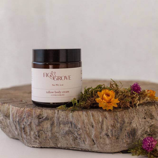 Tallow body cream in a 4 oz amber jar