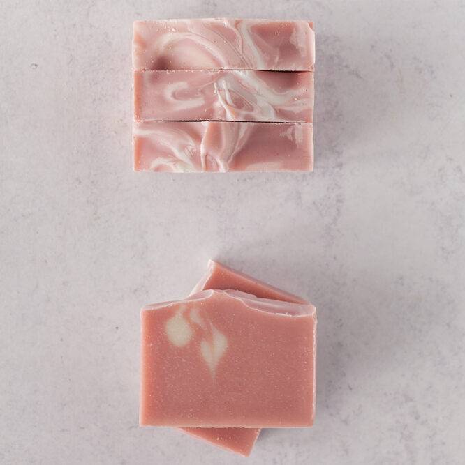 Geranium citrus rose clay handmade soap on neutral background