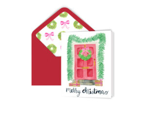 Watercolor Red Front Door Holiday Greeting Card features watercolor red front door decorated for Christams. The red envelope is lined with watercolor pattern of wreaths and pink bows.