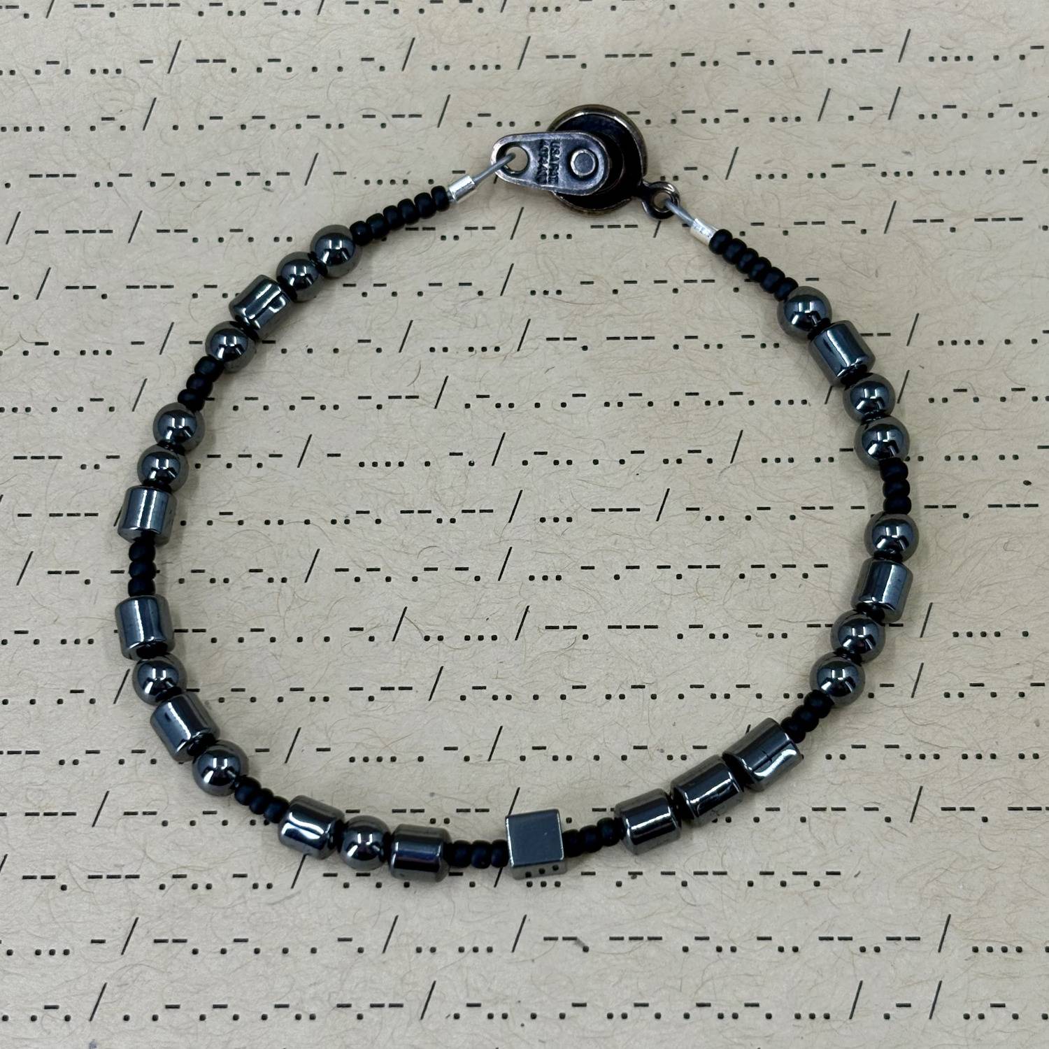 Fuck Off Morse Code Bracelet in Hematite and small glass beads.