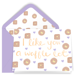 Our waffle blank card displayed with a purple envelope. The card has our illustrated waffle heart pattern and the lettered words I Like You A Waffle Lot The envelope is lined with our waffle pattern.