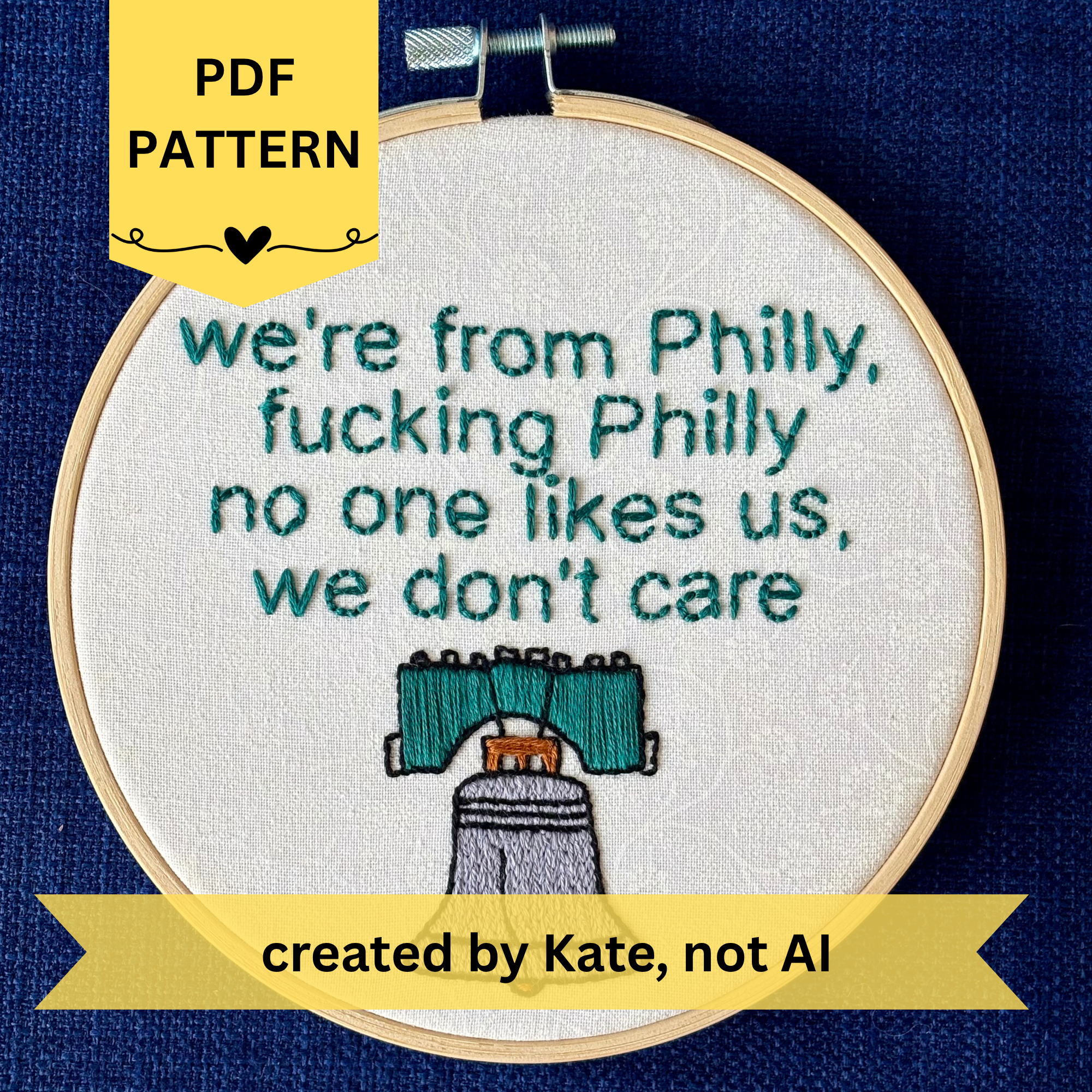 PDF pattern created by Kate, not AI. we're from Philly, fucking Philly, no one likes us, we don't care. Quote hand embroidered in eagles green. Silver, green, black liberty bell below. Displayed in light wooden hoop