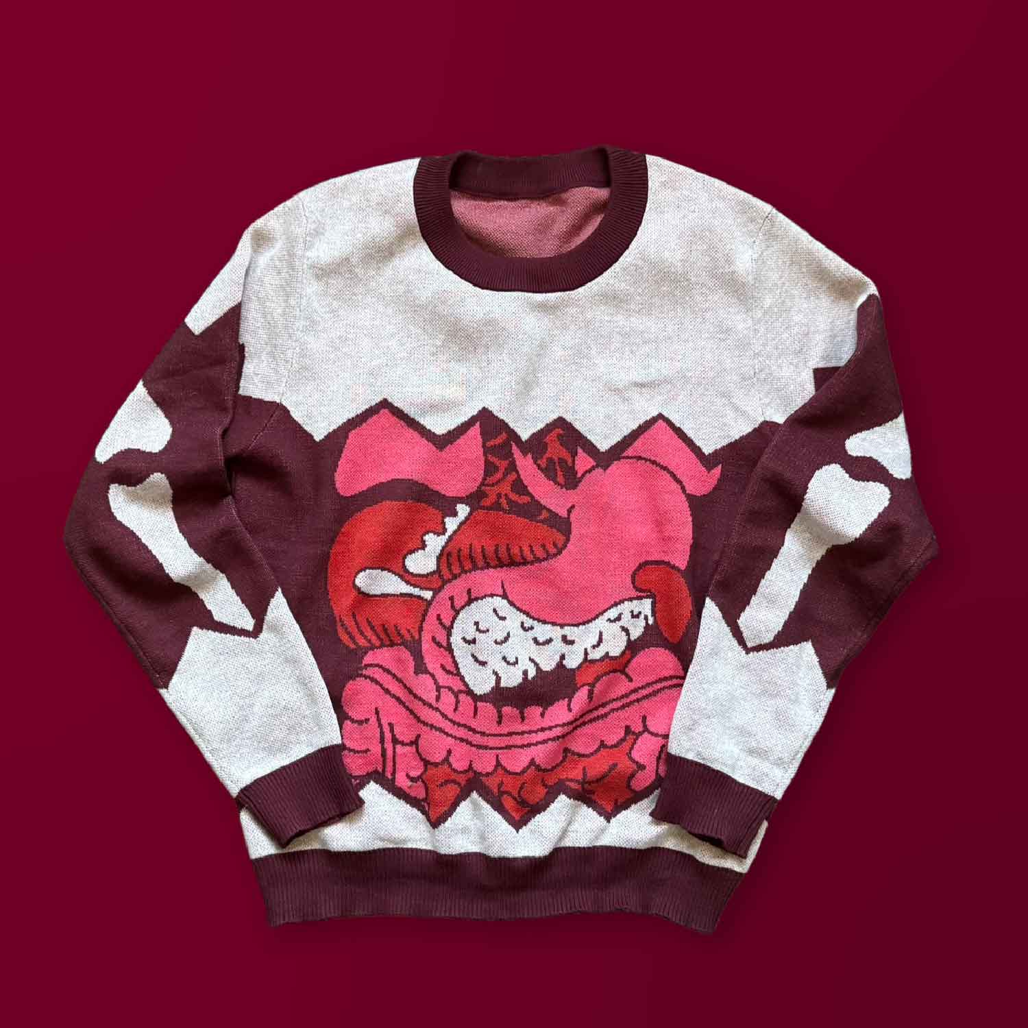 A gray sweater with a design of guts spilling out of the middle