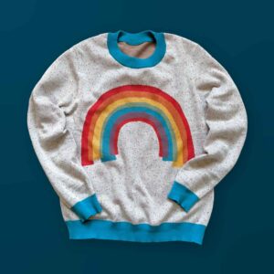 A white sweater with a rainbow design