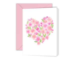 Our Watercolor Cherry Blossom Heart Greeting Card is displayed with a pink envelope. It features our watercolor illustration of cherry blossoms in the shape of heart on a white background.