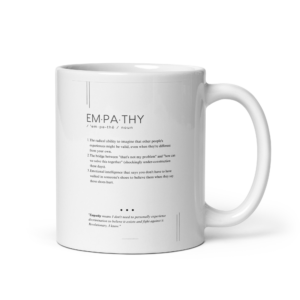 white ceramic mug with editorial message about empathy